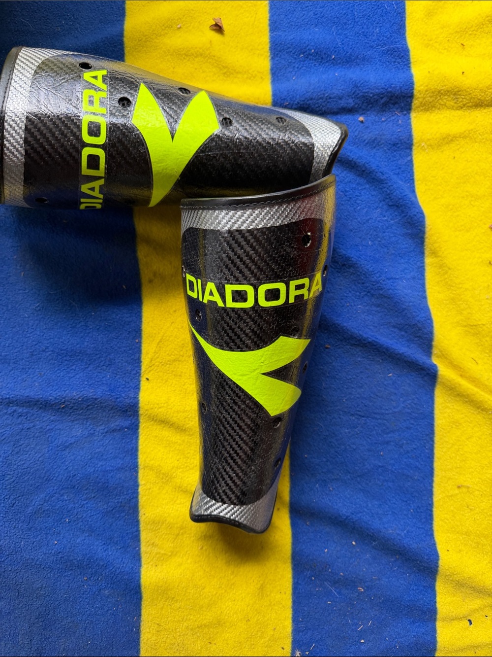 Diadora Black Carbon-Finish Shin Guards with Neon Yellow Accents